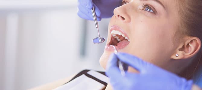 Woman in dental chair during a dental examination